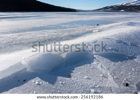 Cracked ice on lake in Aare, Sweden.