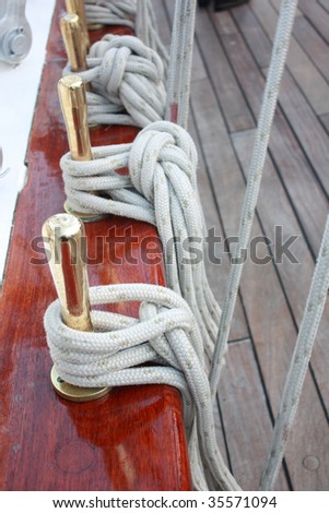 Ship ropes shiny brass and wood planks