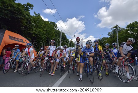 PLOIESTI-ROMANIA - JULY 5: Professional and amateur cyclists, competing for Road Grand Prix event, a high-speed circuit race, July 05, 2014 in Ploiesti-Bucharest, Romania - Stock Editorial Photography