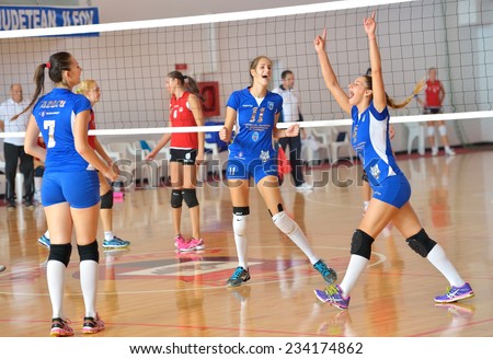 BUCHAREST, ROMANIA - OCTOBER 10:Players of CSM Bucharest happy after winning a point during the match with CSU Cluj, in Romanian Volleyball National Championship October 10,2014 in Bucharest, Romania