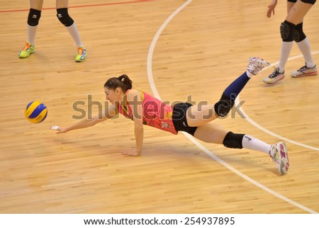 BUCHAREST, ROMANIA - FEBRUARY 18:Georgiana Fales try to save a point during the match between CSM Bucharest and CS Stiinta Bacau, Romanian Volleyball National Cup February 18,2015 Bucharest, Romania