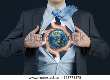 Employee tearing the shirt, hands holding the earth. Elements of this image furnished by NASA.