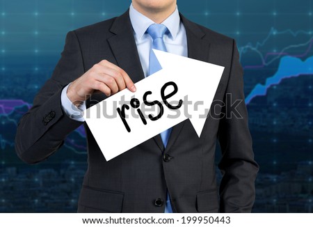 Businessman is holding an arrow sign with the word \'rise\' which confirms the stable increase of forex market.