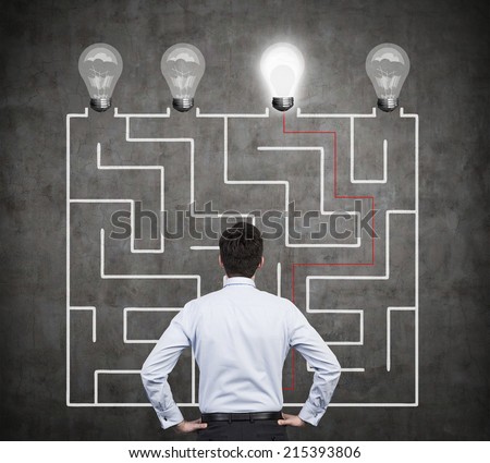 Confused businessman brainstorming the labyrinth to find the solution