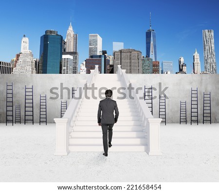 A concept of successful career. Businessman is climbing on the top of the rank.