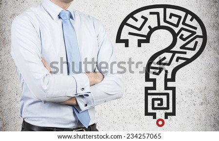 Maze in a shape of Question mark and businessman is looking for the solution.