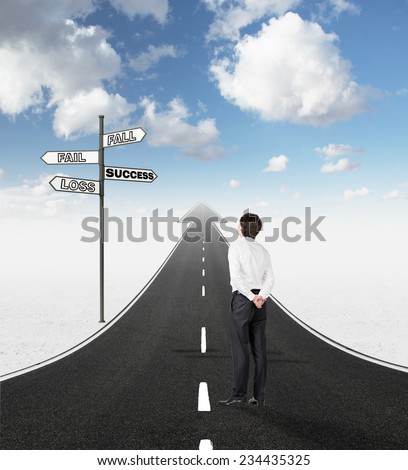 Career development business concept. Businessman is standing on the highway leading to an arrow nearby the road sign with several directions.