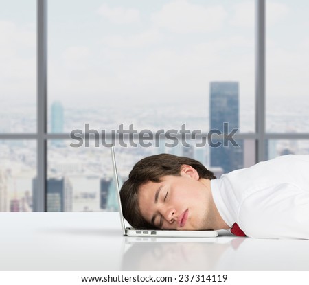 businessman sleeping on the job in office