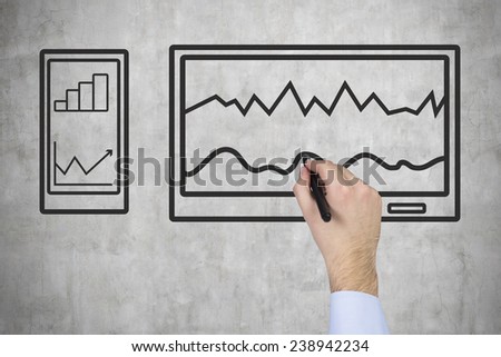 hand drawing tablet with chart on wall