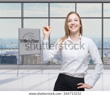 Young lawyer lady is pointing out to the workflow process in a modern office with panoramic New York view.