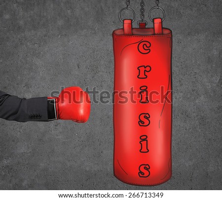 A hand in business suit is hitting the red punching bag, business concept