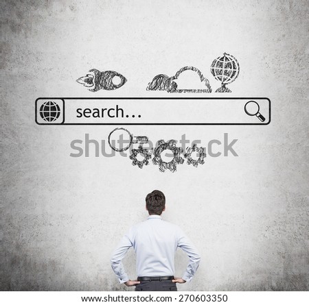 Rear view of the businessman who is looking at the wall with the drawn internet search bar and different icons. A concept of business management process.