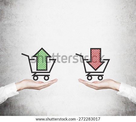 Hands offer the choice - \'sell or buy\'. Basket of goods. A concept of trading processes.
