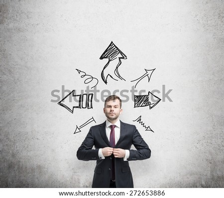 businessman is standing surrounded by arrows in different direction. A concept of decision making process.