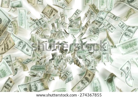 Flying dollar notes over white background.