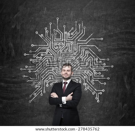 Handsome information technology specialist is thinking about optimisation of the business process\' structure. Microchip sketch behind the standing person.