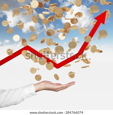 Close up of the open palm and falling golden dollar coins from the sky. Red arrow is going up as a symbol of the growth in economy. Cloudy sky background.