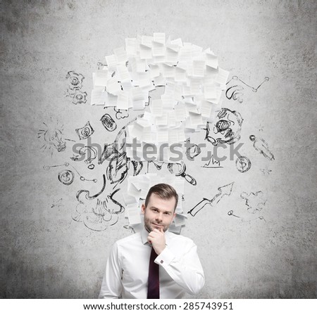 Confident businessman is thinking about the question mark which consists of the contract pages. Concrete background.