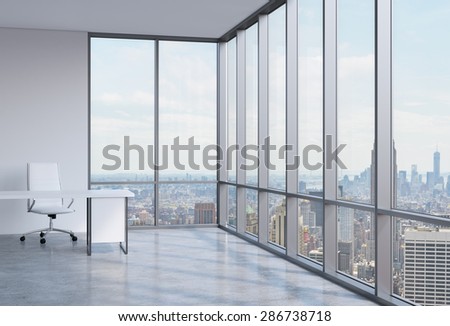Work space in a modern panoramic corner office in New York.