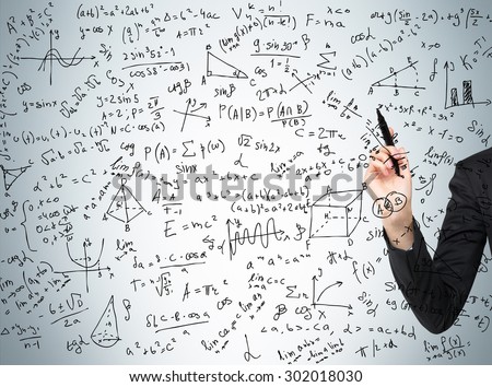Woman\'s hand is pointing out the complicated math calculations. Math formulas are written on the glass screen.