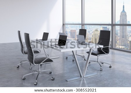 Modern meeting room with huge windows looking at New York City. Black leather chairs and a white table with laptops. 3D rendering.