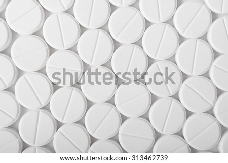 Heap of medicine pills. Background made from white pills.