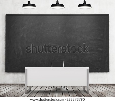 Teacher\'s or professor\'s desk in a modern university. A huge black chalkboard on the wall and three black ceiling lights, wooden floor. 3D rendering.