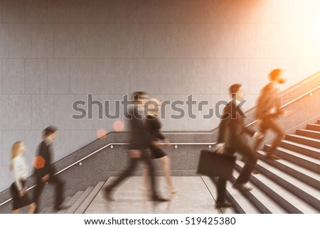 Side view of business people climbing a stair in a building on a morning. Concept of business person\'s routine. Toned image. Mock up