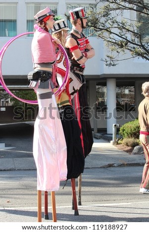 STAMFORD, CT - NOVEMBER 18, 2012: Acrobats on stilts waiting for their turn to march on the UBS Parade Spectacular on November 18, 2012 in Stamford, CT