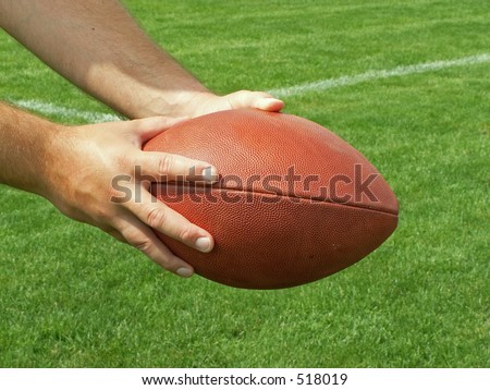 handing off the football