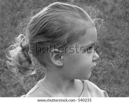 black & white of little girl with a pony tail