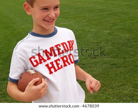 young boy playing football and wearing a 