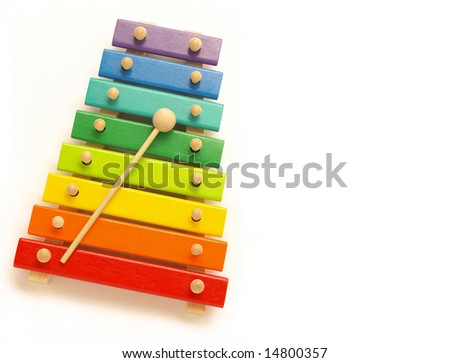 colorful, wooden xylophone with mallet over white - stock photo