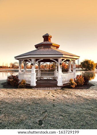 gazebo with footprints on frost covered grass