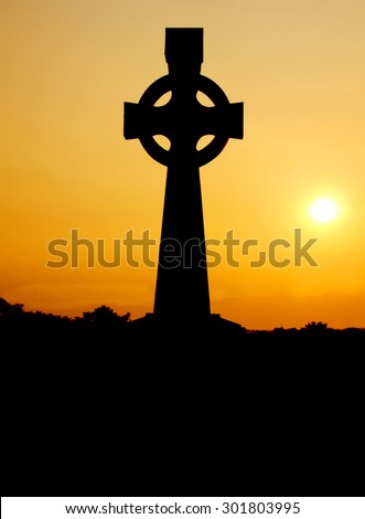 Celtic cross in silhouette on Tipperary Hill, a prodominatly Irish- American suburb of Syracuse, New York