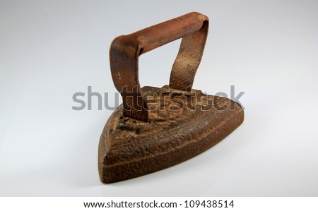 Old rusted iron useful for ironing clothes