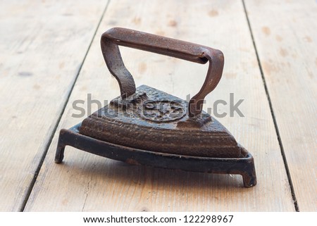 Old rusted iron useful for ironing clothes