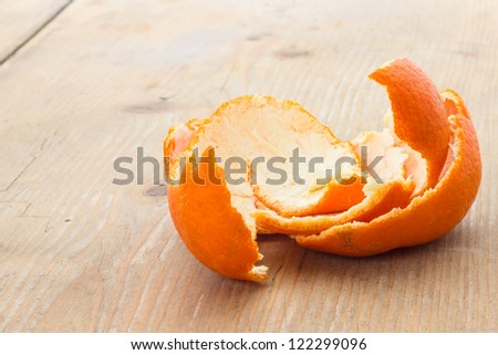 Tangerine peel on the table in front of a window