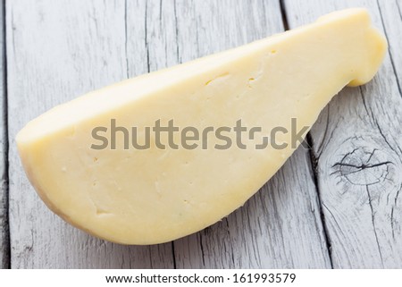 Slice of scamorza cheese from Italy