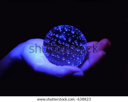 Blue sphere on a hand
