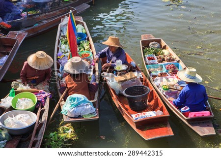 THA KHA FLOATING MARKET ,THAILAND-February 22:Tha Kha Floating Market on February 22:,2015 in Thailand.Featuring many small boats laden with colourful fruits, vegetables and Thai cuisine.