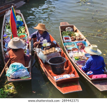 THA KHA FLOATING MARKET ,THAILAND-February 22:Tha Kha Floating Market on February 22:,2015 in Thailand.Featuring many small boats laden with colourful fruits, vegetables and Thai cuisine.