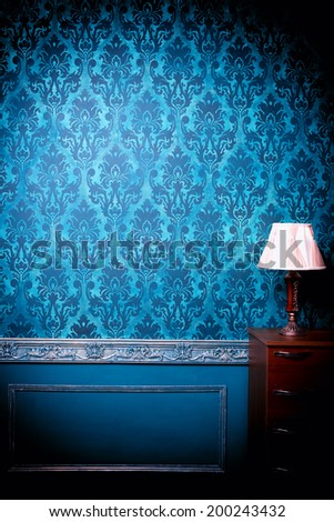 Luxury vintage interior with blue toning. Vignette. Studio professional lighting. Retro decor. Pattern wallpaper