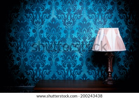 Old lamp in blue vintage interior. Professional lighting. Rich rococo interior