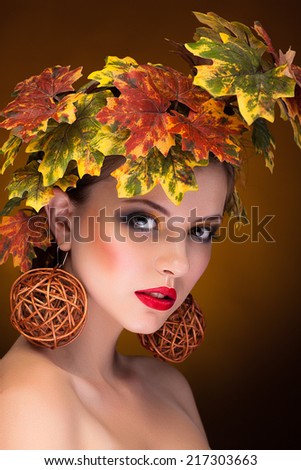 Woman with fashion art concept of autumn. Studio shooting. Beauty and fashion. Beautiful portrait in fashion art concept of autumn