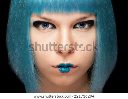 Anime girl with blue hair on black background. Studio shooting. Anime, manga. Hairstyle and color. Blue hair and lips. Cool girl