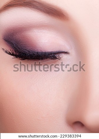 Close up eye with professional make up. Studio shooting and lighting