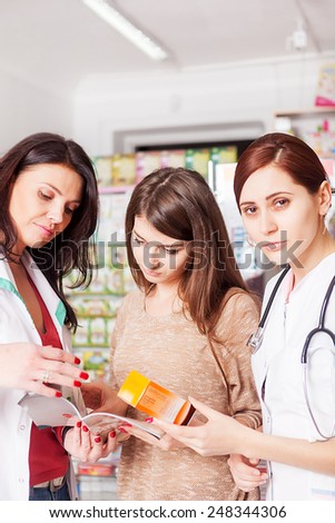 Pharmacist, doctor and client inside a pharmacy. Healthcare buiness. Business. Healhtcare and client care. Pharmaceutics