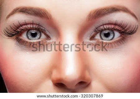 Expressive eyes with make up and big eyelashes. Studio shooting. Beauty face. Advertising for make up