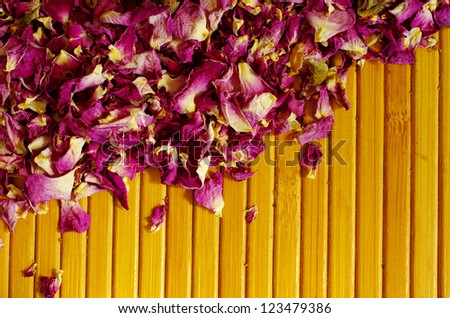 dried rose petals on the wood